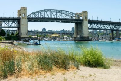 View of Burrard Street Bridge (1932) and Granville Island beyond, seen from Sunset Beach, Vancouver, BC, Canada.