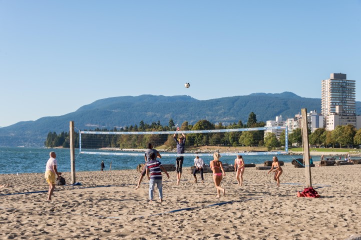 People playing beach volley at Vancouver English Bay beach in summer. Vancouver, British Columbia, Canada - 14 September 2017.